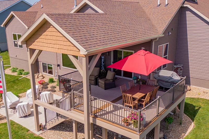 Elevated Composite Deck with Overhang and Outdoor Living Features in Cedar Falls